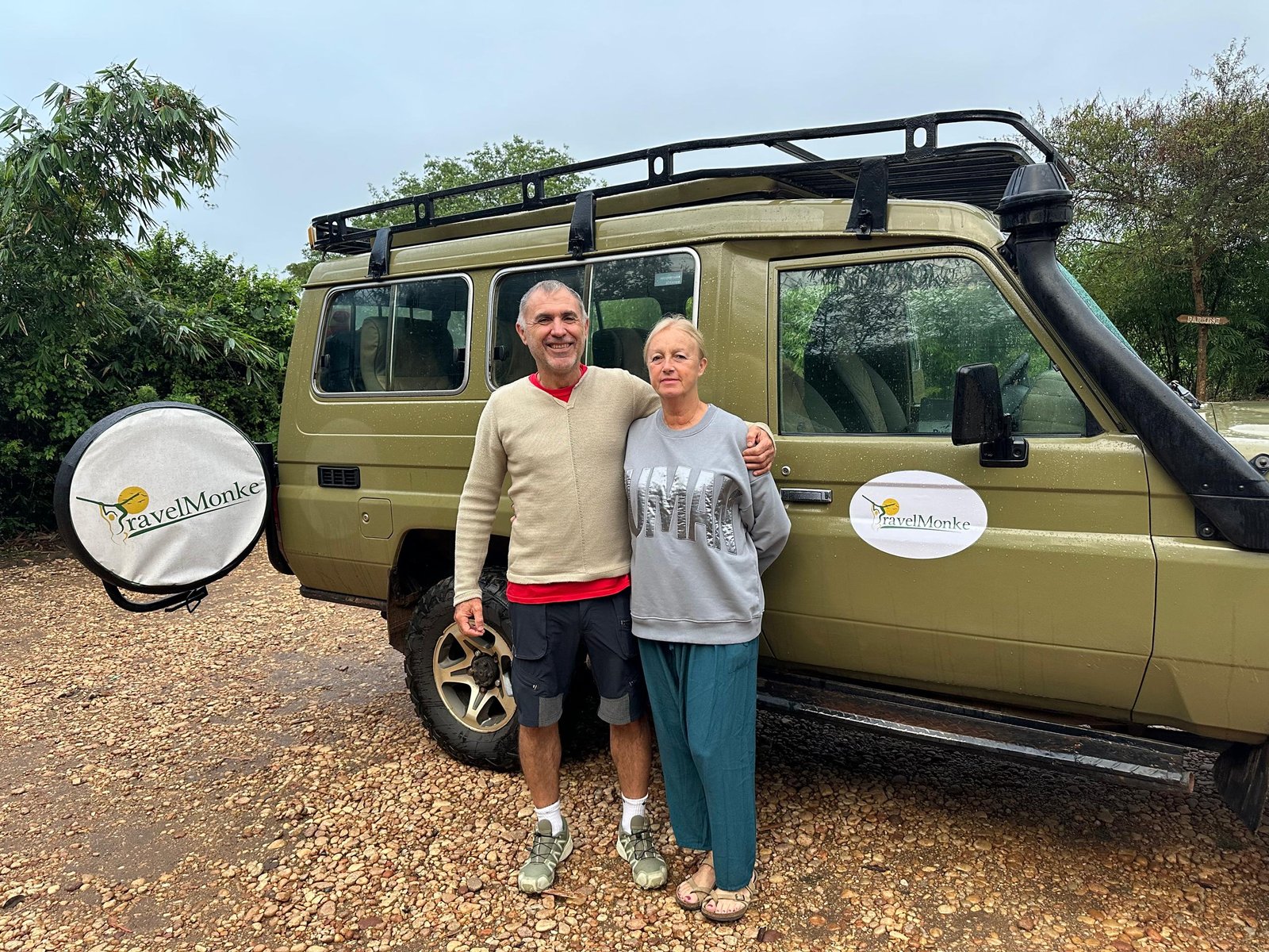 Travelmonke guests with their safari vehicle in Murchison Falls